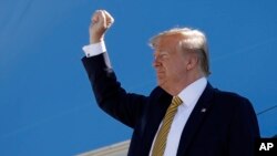 FILE- President Donald Trump boards Air Force One at Albuquerque International Sunport in Albuquerque, N.M, Sept. 17, 2019. 