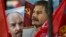 Communist party supporters carry portraits of Soviet founder Vladimir Lenin, left, and Soviet dictator Josef Stalin during a demonstration marking the 100th anniversary of the 1917 Bolshevik revolution in Moscow, Russia, Nov. 7, 2017.
