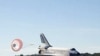 Space shuttle Atlantis lands on runway 33 at NASA Kennedy Space Center's Shuttle Landing Facility concluding the STS-129 mission, 27 Nov 2009