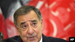 U.S. Defense Secretary Leon Panetta speaks during a news conference after meeting with troops and Afghan President Hamid Karzai and other Afghan officials, at the airport in Kabul, March 15, 2012.
