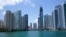 FILE - The skyline of Miami is seen at the entrance to the Miami River from a boat on Biscayne Bay, May 9, 2022.