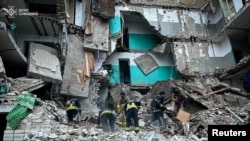 Rescuers enactment    astatine  a residential gathering  deed  by a Russian drone onslaught   successful  the municipality  of Hlukhiv, Sumy region, successful  this handout representation   released Nov. 19, 2024. (Press work  of the State Emergency Service of Ukraine successful  Sumy region/Handout via Reuters)