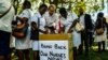 FILE: People cast their letters of complaint to Zimbabwe deputy President Chiwenga among nurses who had gathered at Unity Square in Harare on April 20, 2018 to demonstrate their discontent in a #BringBackOurNurses campaign after being summarily dismissed by Zimbabwe Vice President Constantino Chiwenga. / AFP PHOTO /