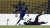 Cape Verde's midfielder #10 Jamiro Monteiro (L) kicks to score his team's first goal next to Ghana's goalkeeper #1 Richard Ofori (R) during the Africa Cup of Nations (CAN) 2024 group B football match between Ghana and Cape Verde at the Felix Houphouet-Boi