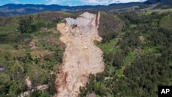 This photo released by UNDP Papua New Guinea, shows a landslide in Yambali village, in the Highlands of Papua New Guinea, May 27, 2024. Authorities fear a second landslide and a disease outbreak are looming at the scene of Papua New Guinea's recent mass-casualty disaster.