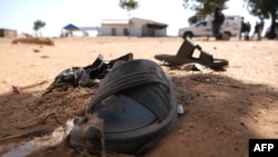 Students' shoes are left behind after gunmen abducted hundreds of boys at the Government Science School in Kankara, in northwestern Katsina state, Nigeria, Dec. 15, 2020.