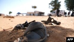 Students' shoes are left behind after gunmen abducted hundreds of boys at the Government Science School in Kankara, in northwestern Katsina state, Nigeria, Dec. 15, 2020.