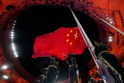 The Chinese national flag is raised during the opening ceremony of the 2022 Winter Olympics in Beijing on February 4, 2022 (Natacha Pisarenko/AP)