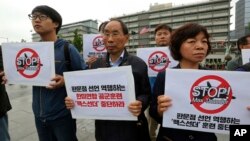 South Korean protesters stage a rally against the Max Thunder joint military exercise between the United States South Korea near the U.S. Embassy in Seoul, South Korea, May 16, 2018.