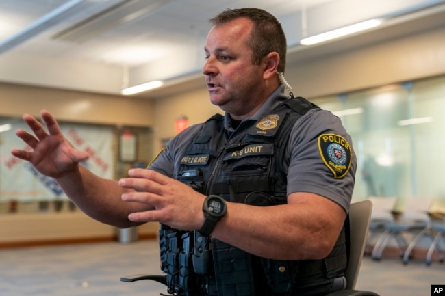 Sgt. Matt Gilmore gestures as he talks about using Axon's Draft One AI software during an interview at Oklahoma City police headquarters on Friday, May 31, 2024 in Oklahoma City, Oklahoma. (AP Photo/Nick Oxford)