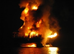 U.S. Coast Guard and other agencies respond to the 2010 Deepwater Horizon oil rig fire in the Gulf of Mexico. (Otto Candies/US Coast Guard Press)