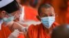 A Buddhist monk receives a dose of the AstraZeneca COVID-19 vaccine at a temple as the in Bangkok on July 30, 2021. Chalinee Thirasupa/Reuters 