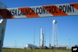 FILE - Northrup Grumman's Antares rocket is poised for launch at the NASA Wallops test flight facility in Wallops Island, Va., Oct. 1, 2020.