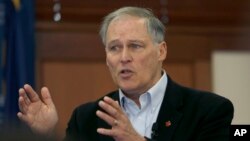 Washington Gov. Jay Inslee speaks to students at Saint Anselm College, Jan. 22, 2019, in Manchester, N.H. 