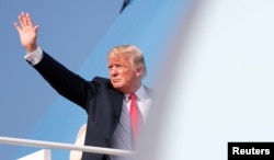 President Donald Trump boards Air Force One as he departs from Joint Base Andrews in Maryland, U.S. Aug. 30, 2018.