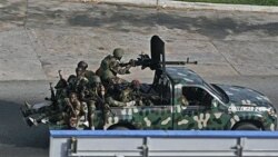 Unidentified troops in the city of Abidjan Friday