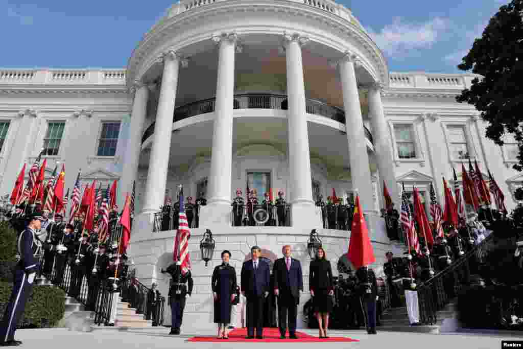 US President Donald Trump and first lady Melania Trump welcome Chinese President Xi Jinping and his wife, Peng Liyuan, during a state arrival ceremony on the South Lawn of the White House in Washington, D.C., US, September 24, 2026. 
