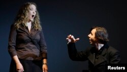 FILE - Conductor Teodor Currentzis, right, accompanies U.S. opera singer Mardi Byers during premiere of Alban Berg opera "Wozzek," Bolshoi theater, Moscow.