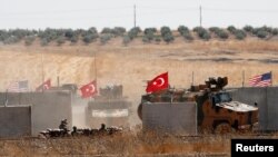 Turkish troops return after a joint U.S.-Turkey patrol in northern Syria, as it is pictured from near the Turkish town of Akcakale, Turkey, September 8, 2019. REUTERS/Murad Sezer - RC16232986E0