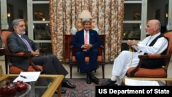 U.S. Secretary of State John Kerry, center, sits with candidates Abdullah Abdullah, left, and Ashraf Ghani. The U.S. helped negotiate a deal to audit the ballots and resolve the dispute.