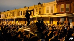 Protesters confront police during a march Tuesday Oct. 27, 2020 in Philadelphia. Hundreds of demonstrators marched in West Philadelphia over the death of Walter Wallace, a Black man who was killed by police in Philadelphia on Monday. Police shot and…