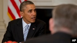 President Barack Obama meets with members of the Democratic Governors Association, in the State Dining Room of the White House in Washington, Feb. 21, 2014.