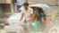 ঢাকার রাস্তায় যাত্রী নিয়ে রিকশাচালক। (ছবি- ইউএনবি) 