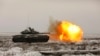 Russian tank T-72B3 fires as troops take part in drills at the Kadamovskiy firing range in the Rostov region in southern Russia, on Jan. 12, 2022. 