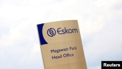 FILE: An Eskom logo is seen at the entrance of its head offices in Sunninghill, Sandton. Feb. 24, 2016. Considering the utility's constant power cuts, some find calling this facility "Megawatt Park" a bit ironic. 