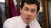 FILE - Pete Buttigieg, mayor of South Bend, Indiana, talks with a reporter at Farmers Market in South Bend, Ind., Jan. 10, 2019.