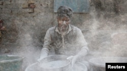 A worker prepares gunpowder to make firecrackers at a factory ahead of Diwali, the Hindu festival of lights, on the outskirts of Ahmedabad, India, October 17, 2019. 