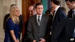 National Security Adviser Michael Flynn, center, arrives in the East Room of the White House in Washington, Feb. 13, 2017.