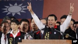 Taiwanese President Ma Ying-jeou declares his victory in the presidential election, Saturday, Jan. 14, 2012, in Taipei, Taiwan.