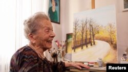 Nada Rudan, a 100-year-old self-taught Bosnian painter, in her home in Sarajevo