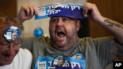 Supporters of Benjamin Netanyahu, former Israeli Prime Minister and the head of Likud party, celebrates the first exit poll results for Israel's election, at the Likud party headquarters in Jerusalem, Nov. 1, 2022.