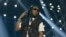 Foto Achiv: Takeoff, rape gwoup Migos la pefome pandan Spektak BET Experience Los Angeles la an 2019. 
