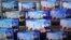 Television screens show a news report about the latest North Korean missile launch with file footage of a North Korean missile test, at an electronic market in Seoul.