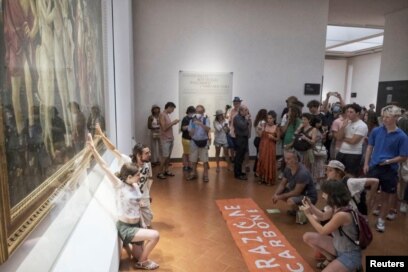 Climate Change Activists Glue Themselves to Priceless Botticelli