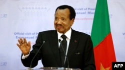 FILE - Cameroon's President Paul Biya gestures as he takes part in a joint press conference with France's President at The Presidential Palace in Yaounde, on July 26, 2022.