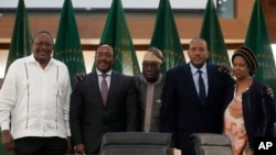 From left, Kenya's former president Uhuru Kenyatta, lead negotiator for Ethiopia's government, Redwan Hussein, African Union envoy Olusegun Obasanjo, lead Tigray negotiator Getachew Reda, and former South Africa's vice president Phumzile Mlambo-Ngcuka pos