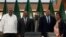 From left, Kenya's former president Uhuru Kenyatta, lead negotiator for Ethiopia's government, Redwan Hussein, African Union envoy Olusegun Obasanjo, lead Tigray negotiator Getachew Reda, and former South Africa's vice president Phumzile Mlambo-Ngcuka pos