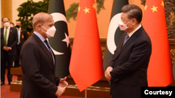 Chinese President Xi Jinping, right, and visiting Pakistani Prime Minister Shehbaz Sharif are seen during their talks in Beijing, China, Nov. 2, 2022. (Courtesy - Pakistan Government via Ayaz Gul)