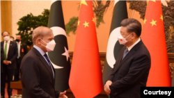 Chinese President Xi Jinping, right, and visiting Pakistani Prime Minister Shehbaz Sharif are seen during their talks in Beijing, China, Nov. 2, 2022. (Courtesy - Pakistan Government via Ayaz Gul)