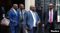 FILE - Timothy Harris, St Kitts and Nevis Prime Minister, and other Caribbean leaders and representatives leave following a meeting with Britain's Prime Minister Theresa May at 10 Downing Street in London, Britain, April 17, 2018.
