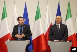 Italian Interior Minister Matteo Salvini, left, and his Polish counterpart Joachim Brudzinski, right, address the media following their talks in Warsaw, Poland, Jan. 9, 2019.