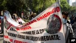 Mexican artisans block Paseo de la Reforma as they protest in Mexico City, June 10, 2020. Hundreds of artisan families are asking for financial help in the wake of the coronavirus.