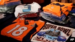 Seized counterfeit NFL merchandise is displayed before a news conference at the NFL Super Bowl XLVIII media center, Thursday, Jan. 30, 2014.