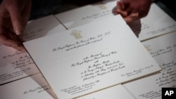Invitations for Prince Harry and Meghan Markle's wedding in May, after they have been printed at the workshop of Barnard and Westwood in London, March 22, 2018.