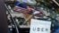 FILE - An Uber sign is seen in a car in New York.
