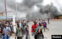 FILE - Congolese opposition supporters chant slogans during a march to press President Joseph Kabila to step down in the Democratic Republic of Congo's capital Kinshasa, Sept. 19, 2016.